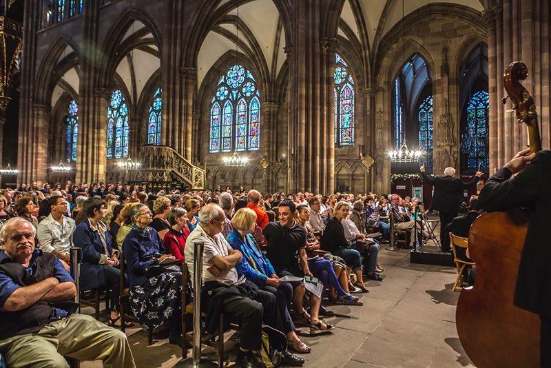 Orchestra performing to full cathedral audience